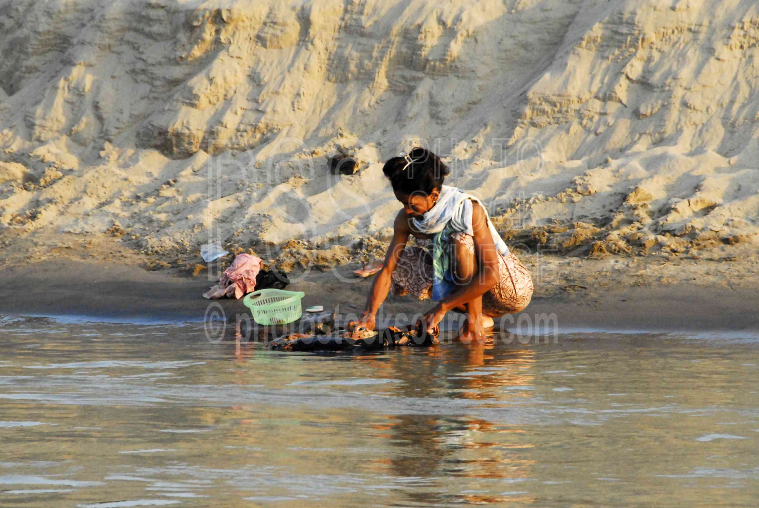 Photo of Woman Washing Clothes by Photo Stock Source people, Bagan, Mandalay Region, Burma