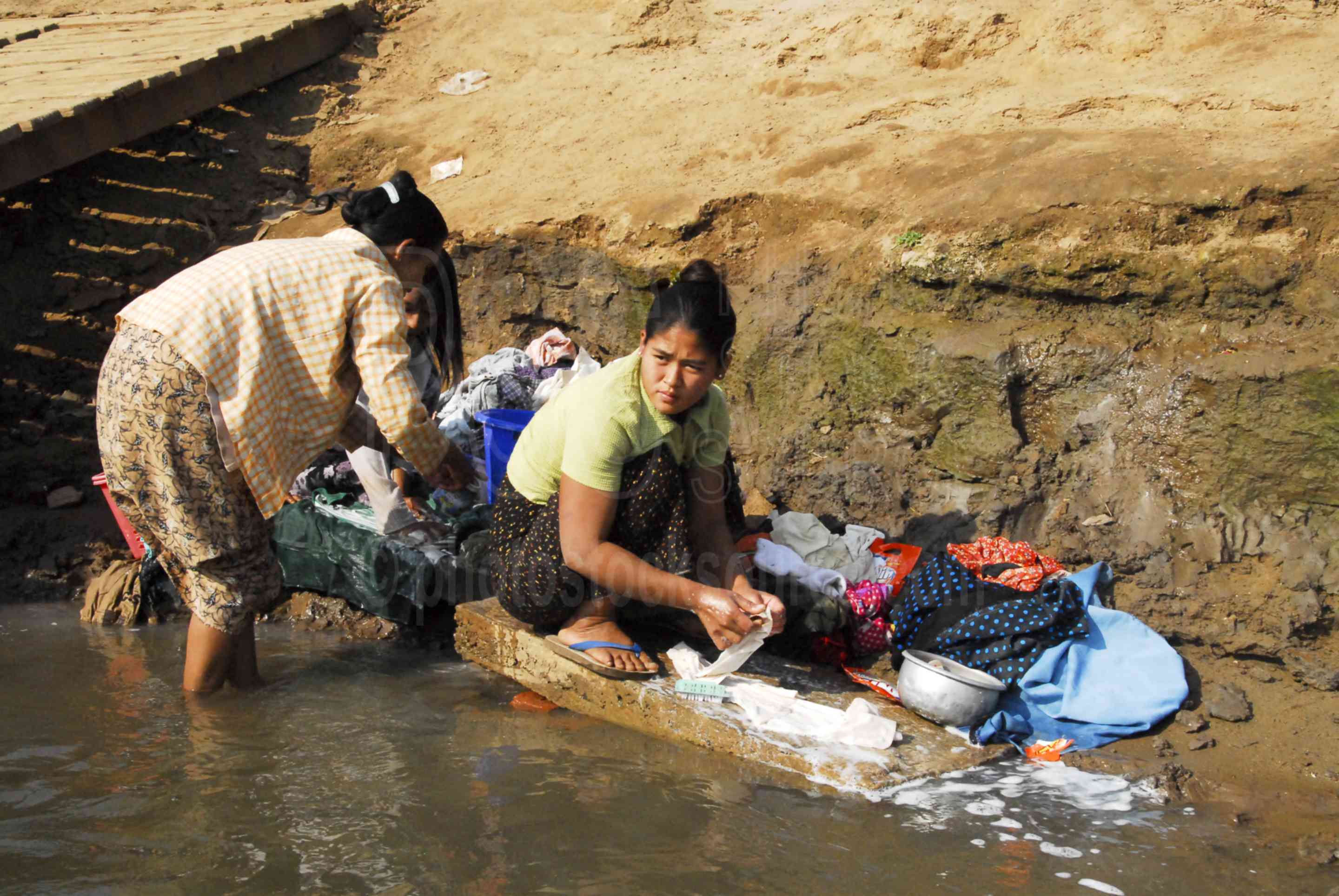 Photo of Women Washing Clothes by Photo Stock Source people, Inwa, Mandalay Region, Burma