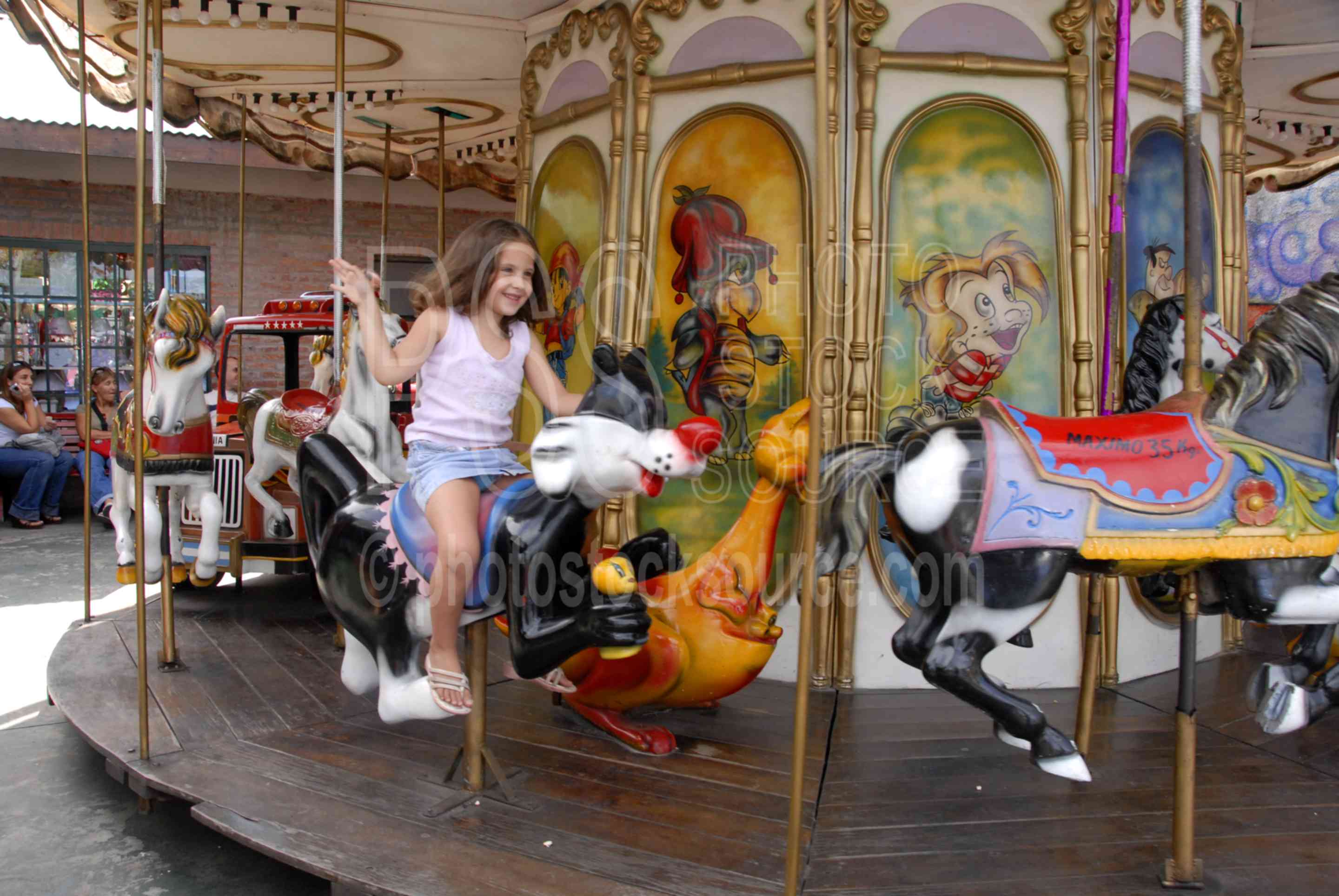 On the Carousel,girl,child,play,playing,recreation,carousel,entertainment,children