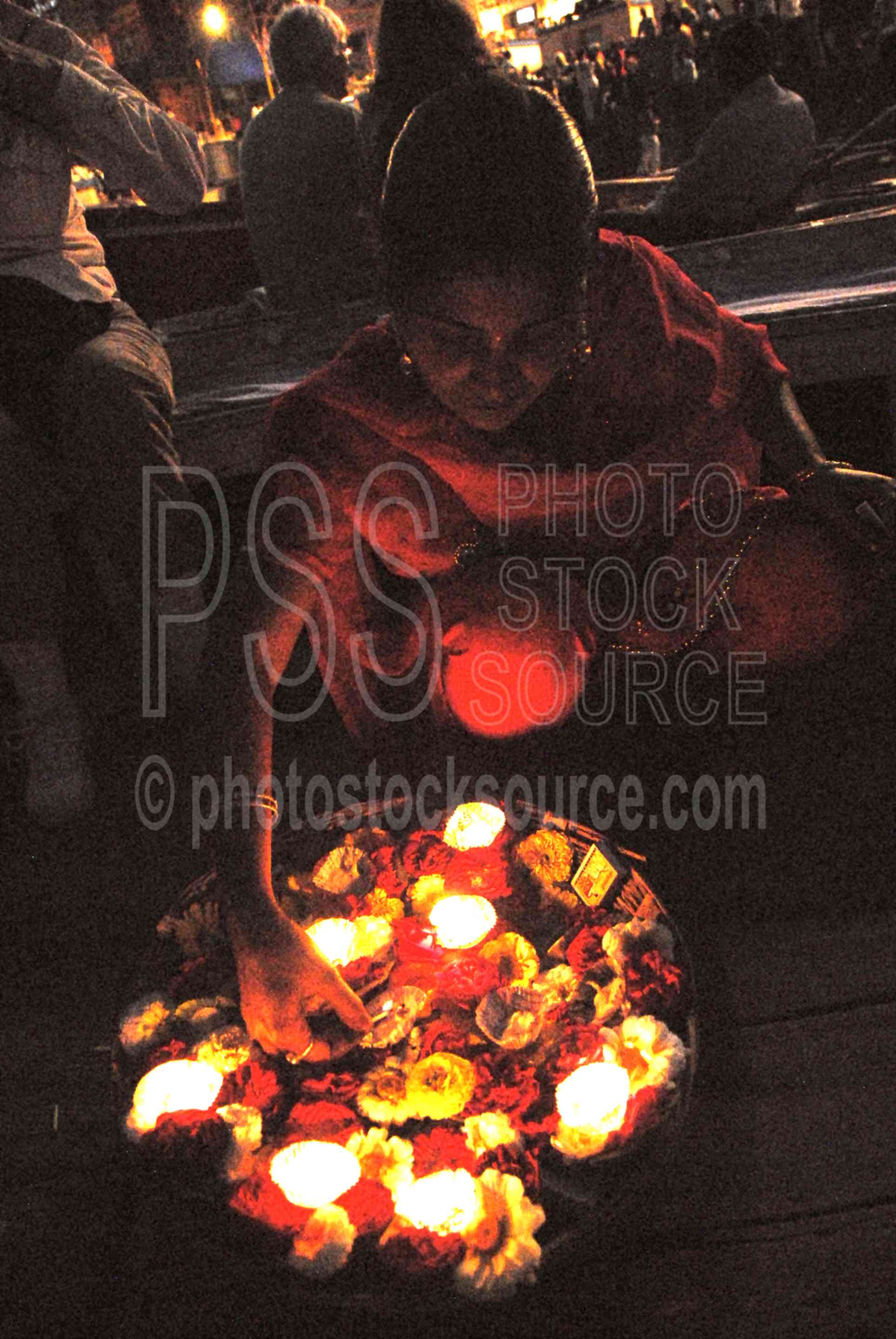 Women with Flower Offerings,river,ganges,ceremony,celebration,religious,dasaswamedh ghat,ganga arti,aarti,ritual,music,night,ganges river,ceremonies