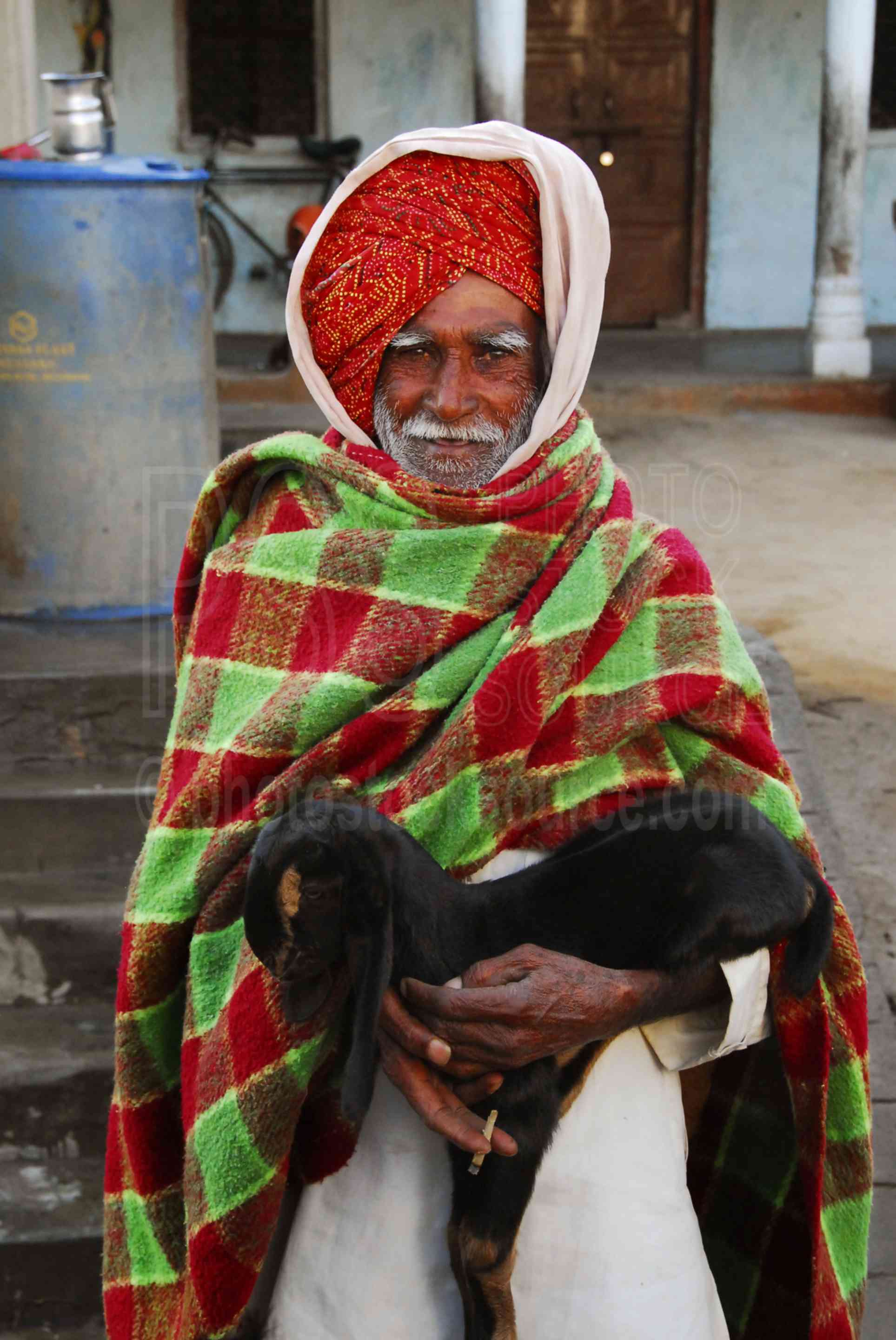 Man with Goat,man,turban,red,goat,young goat,holding,morning