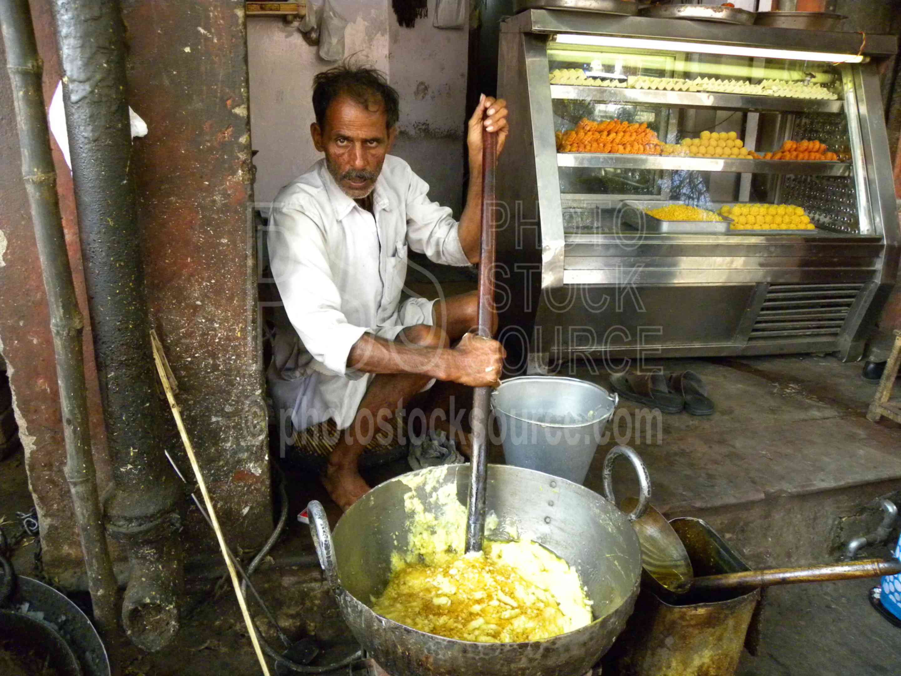 Man Making Usli Ghee,man,working,cooking,stirring,butter,clarified